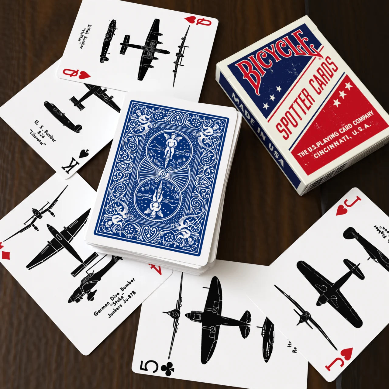 Bicycle Spotter Blue playing cards spread with blue Rider Back card and WWII aircraft silhouettes