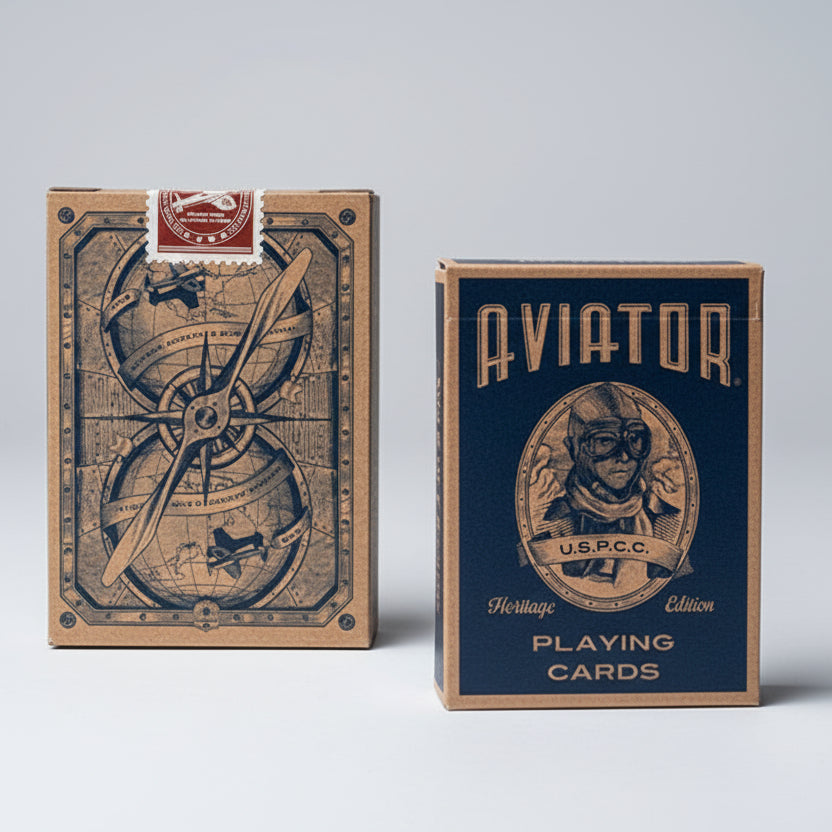 Aviator playing cards on an old map with a vintage airplane model.
