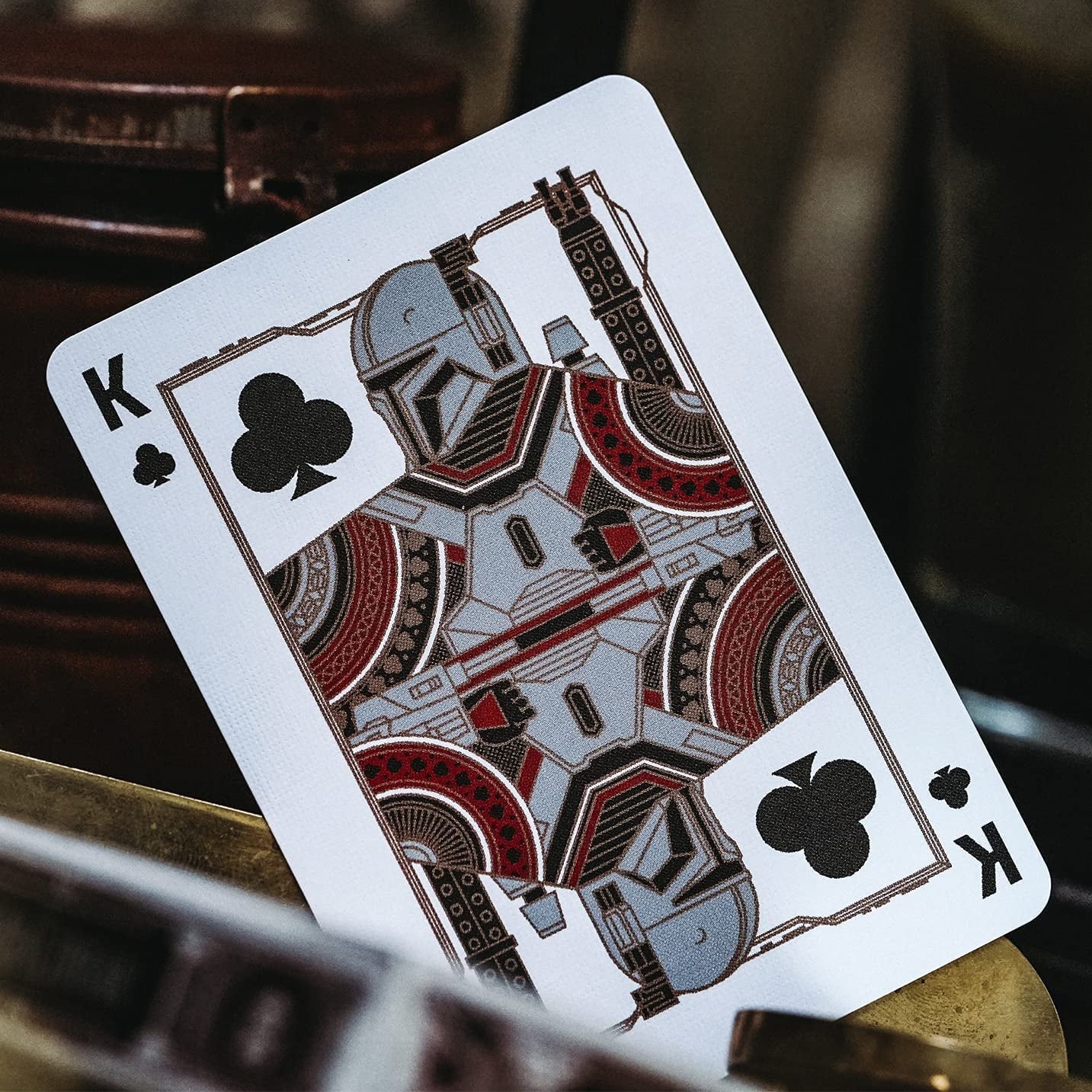 Playing card with a robot design on a dark background