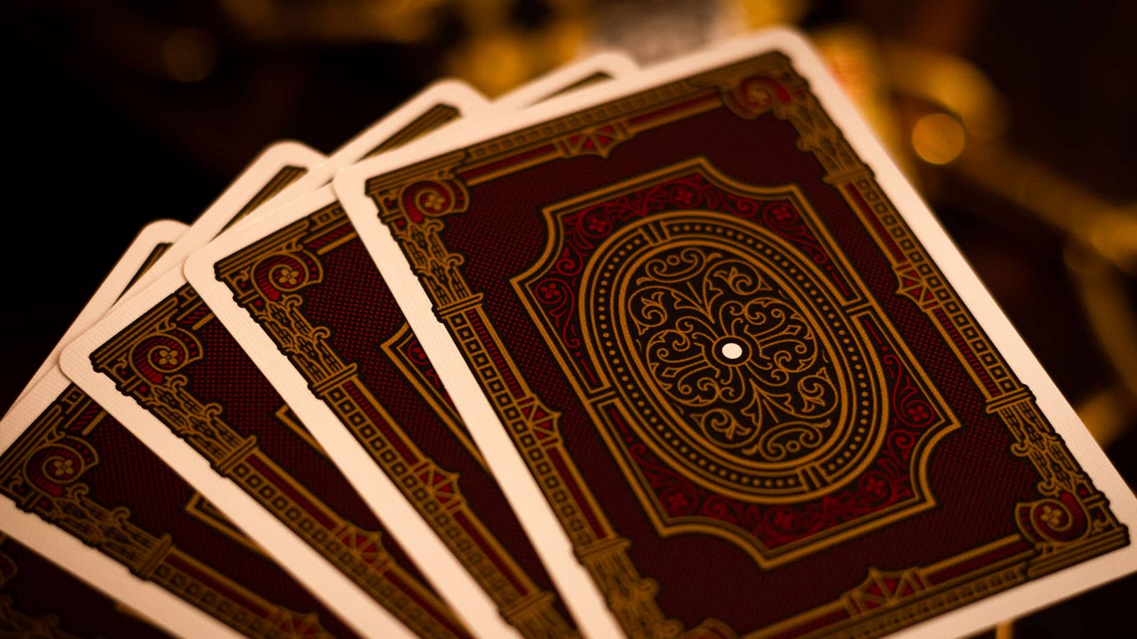 Close-up of ornate Centurio playing cards with a dark background