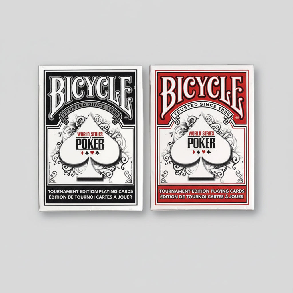 Two Bicycle World Series of Poker playing card decks, one black and white and one red and white, on a light gray background.