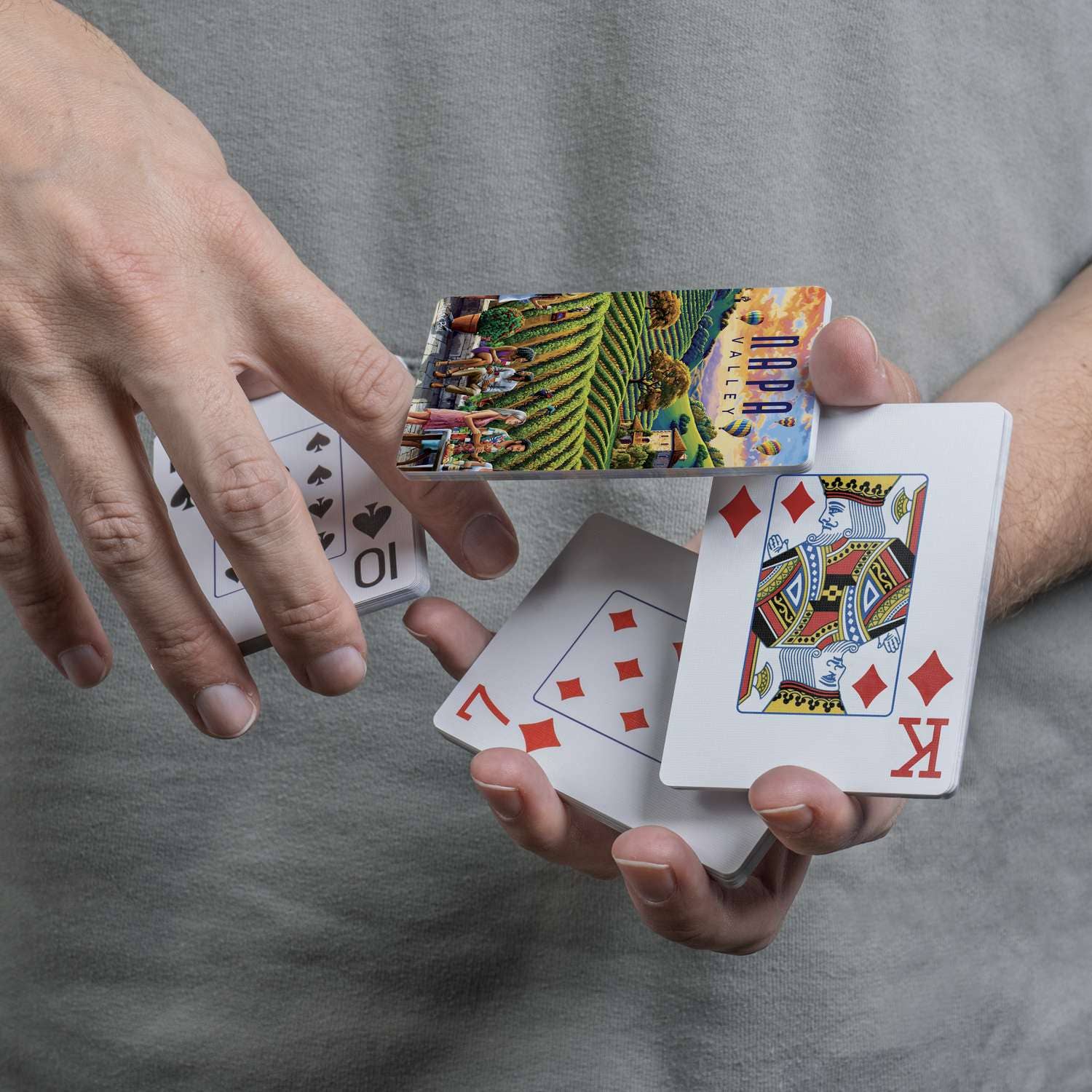 Close-up of Boardwalk Napa Valley card back and traditional playing-card faces