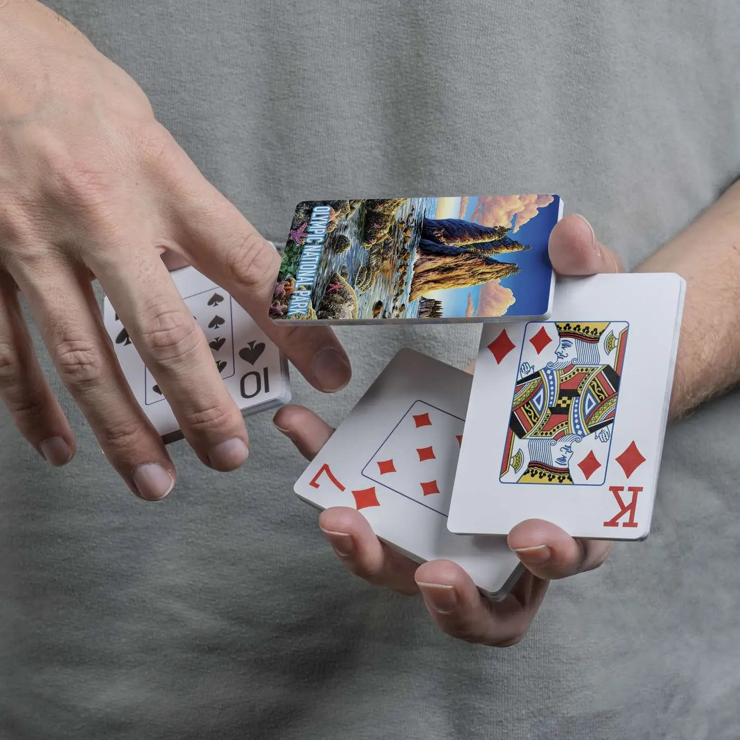 Olympic National Park playing cards displayed in a cascading spring