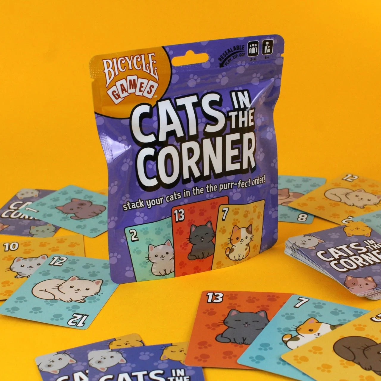Bicycle Cats in the Corner game pouch surrounded by colorful cat cards