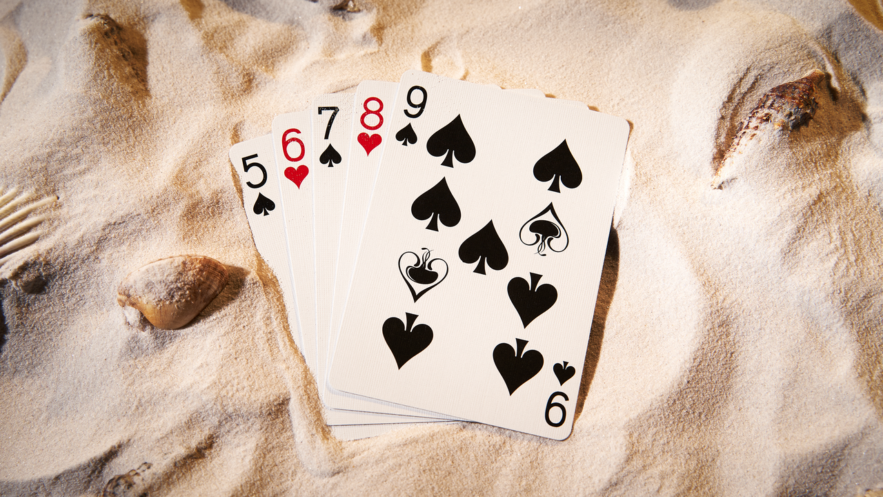 Jellyfish Playing Cards number cards with custom spade pips on sand