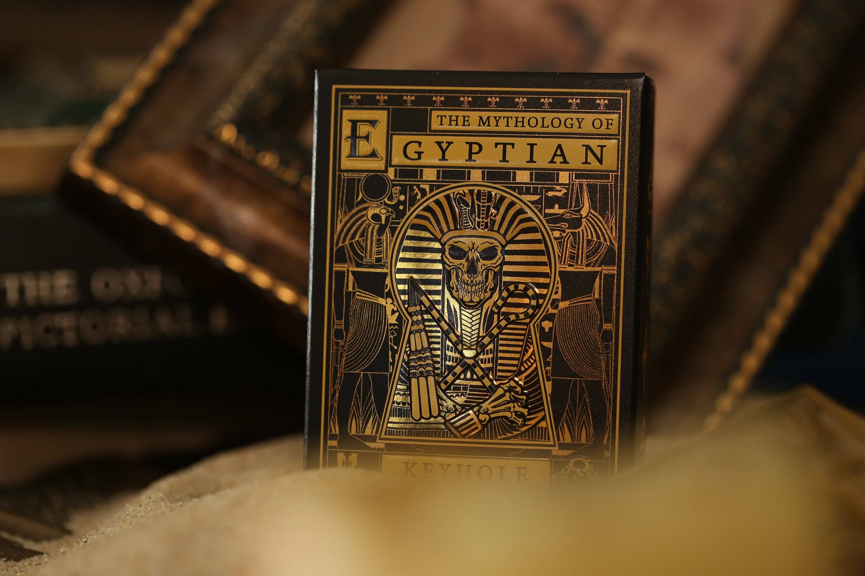 Card deck titled 'The Mythology of Egyptian' with a gold and black design on a textured surface.