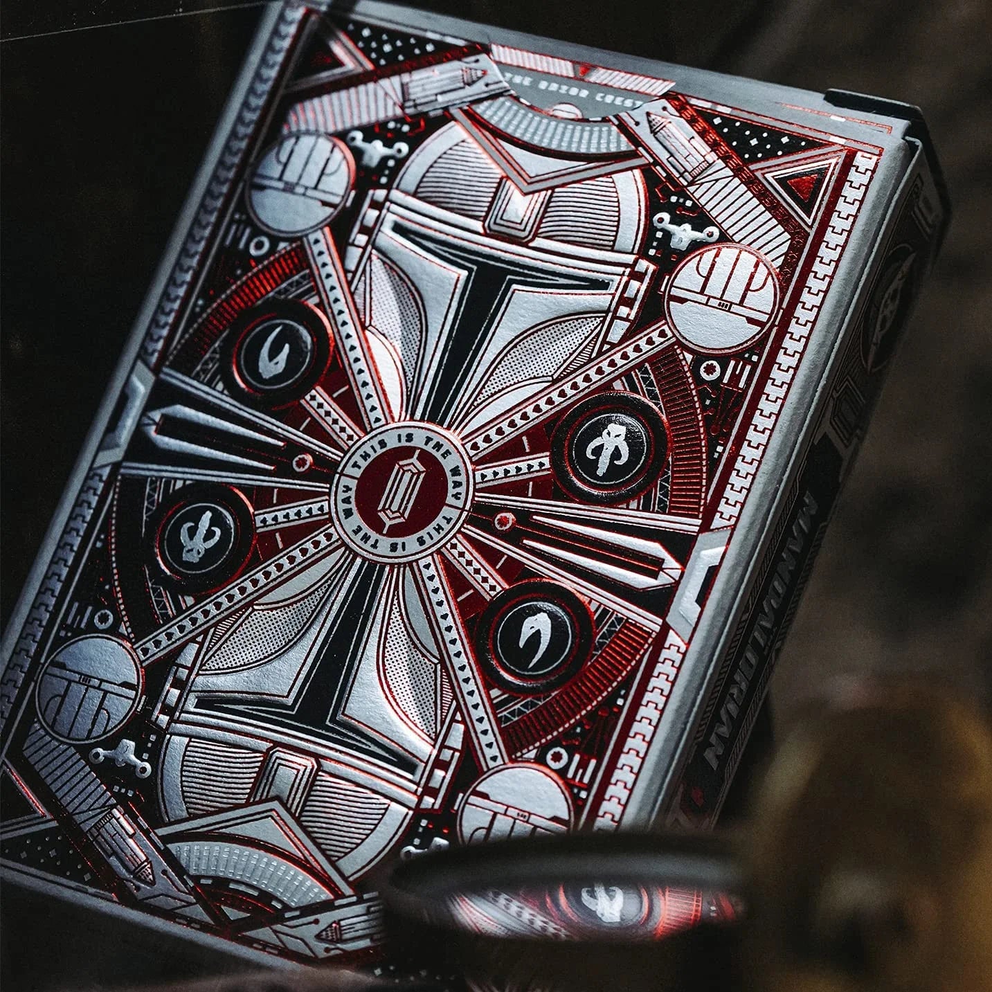 Close-up of a deck of cards with intricate design on a dark background