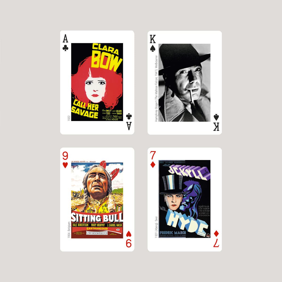 Four Piatink playing cards with vintage movie poster designs on a light gray background