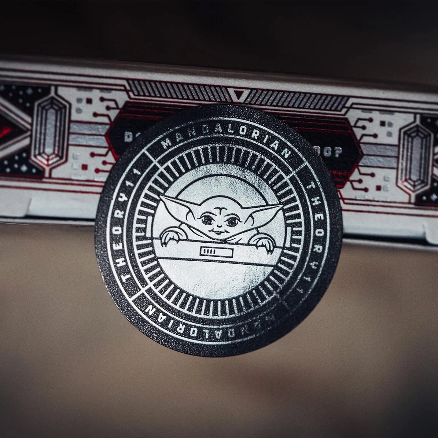 Circular logo with a character design and text on a dark background