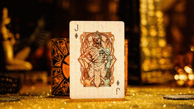 Jack of Clubs playing card with intricate design on a golden surface