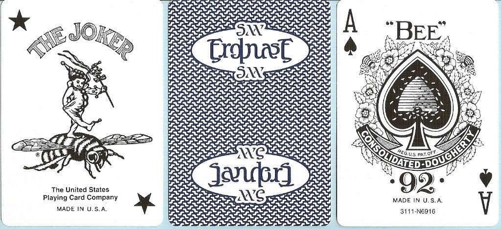 Three playing card designs from different companies with visible branding.