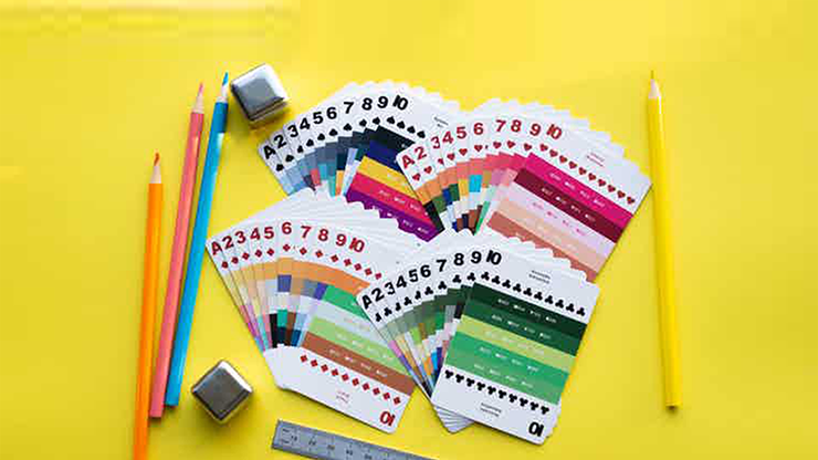 Color swatches with numbers and letters on a yellow background with pencils and a ruler.