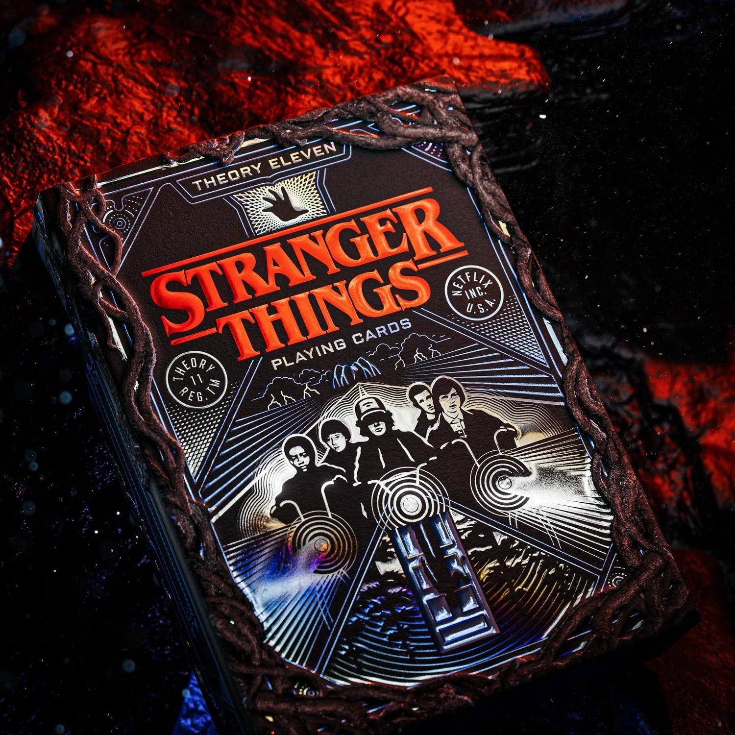 Stranger Things Hive Mind playing cards with a dark, fiery background