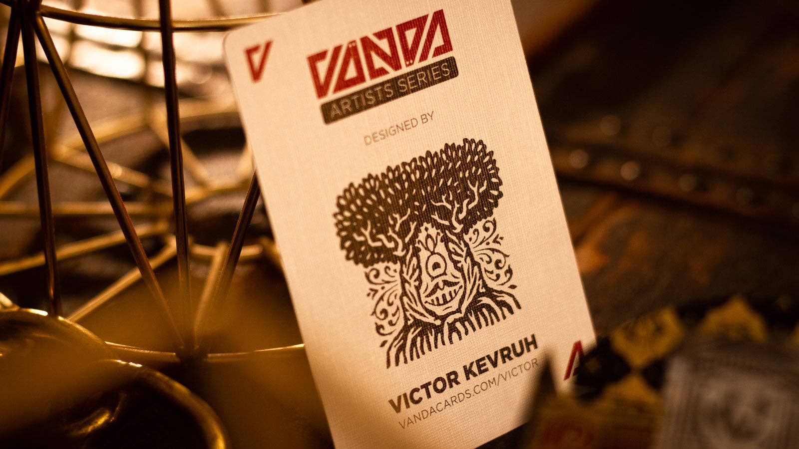 VANDA playing card with a design by Victor Kevrum on a blurred background