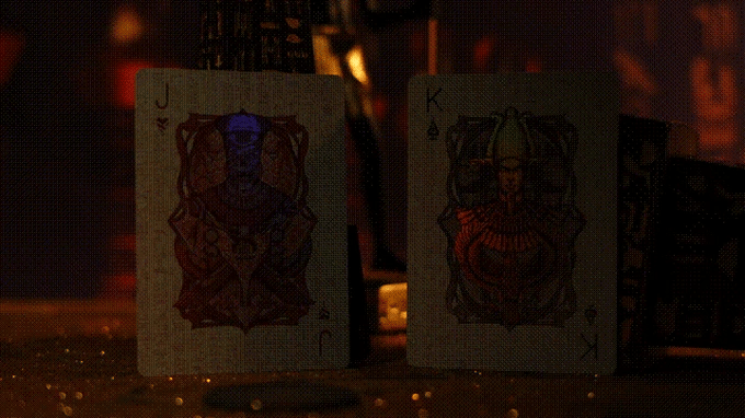 Two playing cards, Jack and King of Spades, on a dark background