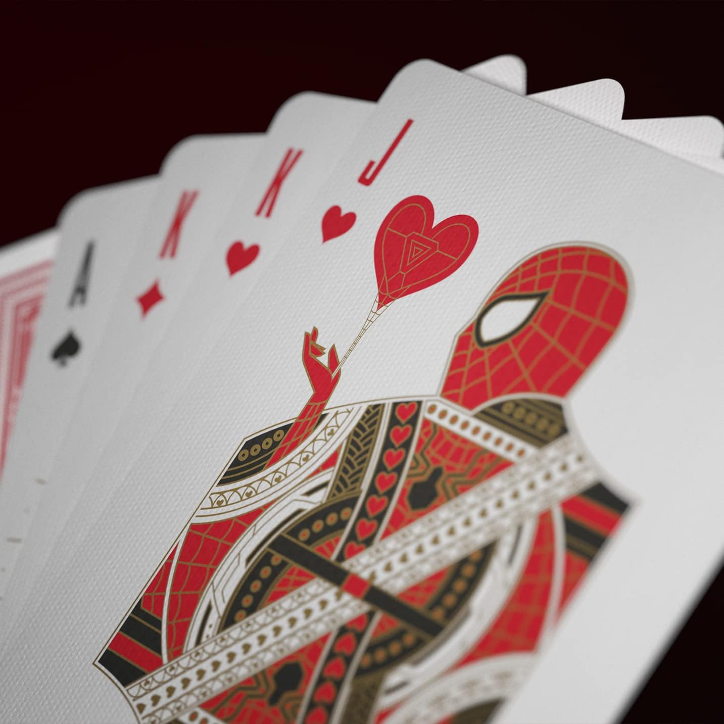 Playing cards with a Spider-Man design on a dark background