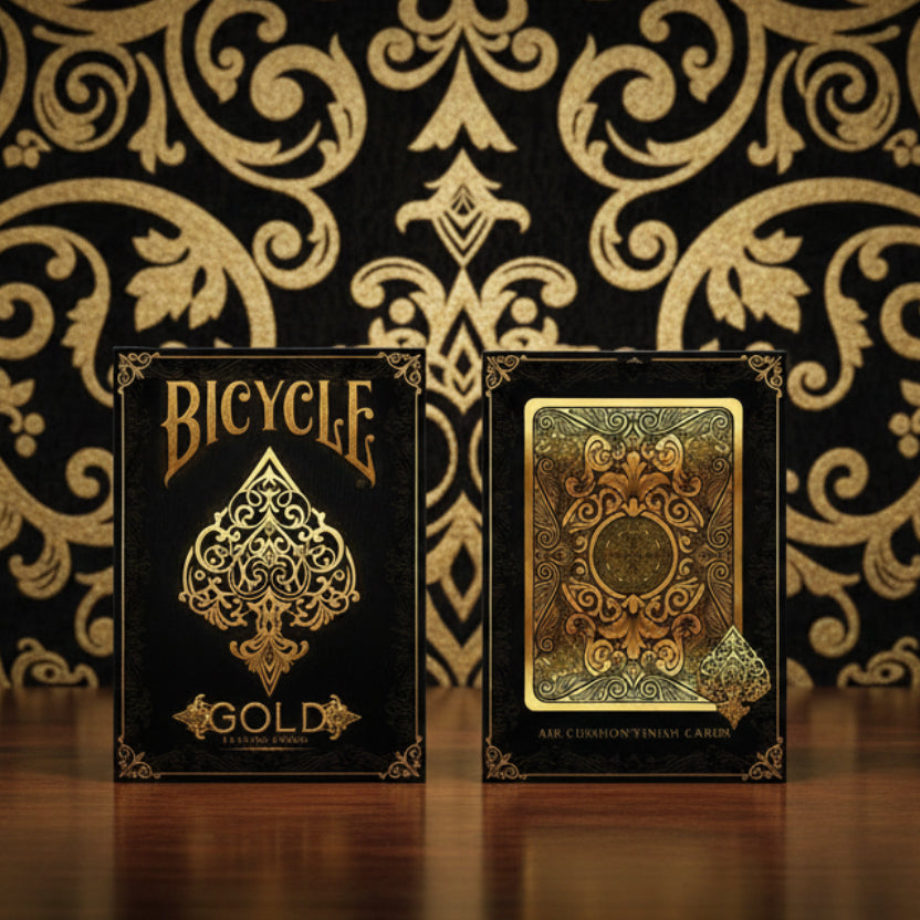 Front and back of Bicycle Gold tuck artwork with large gold spade and decorative card back design.