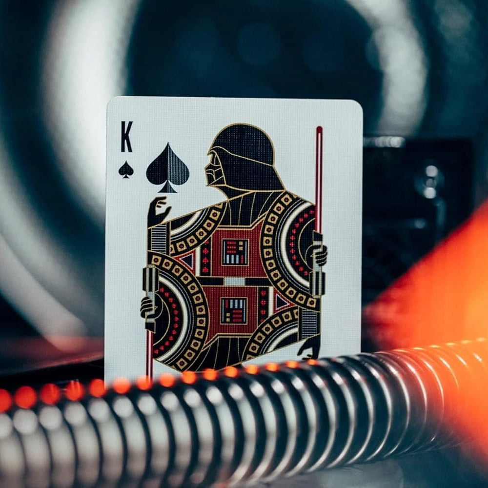 King of Spades playing card with decorative design on a blurred background
