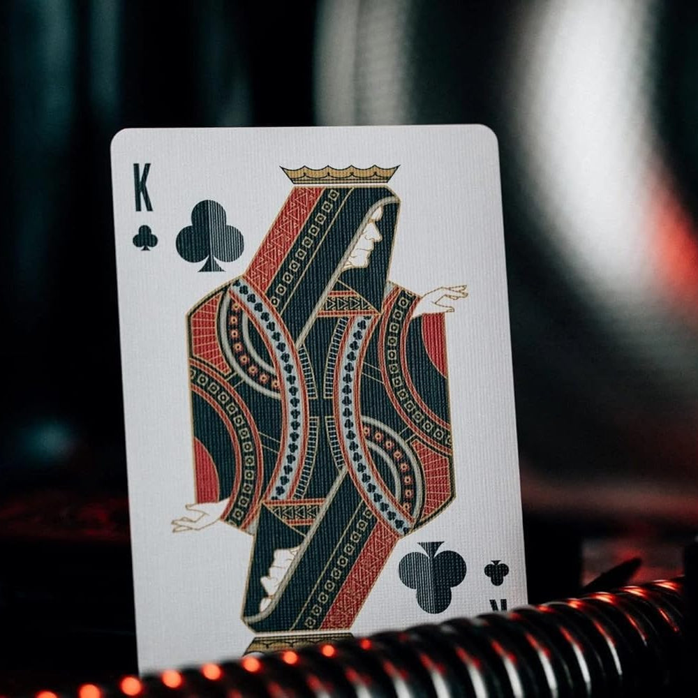 King of Clubs playing card with intricate design on a dark background