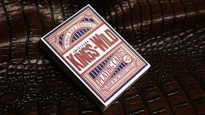 Playing card box with 'Kings & Wild' branding on a textured brown background