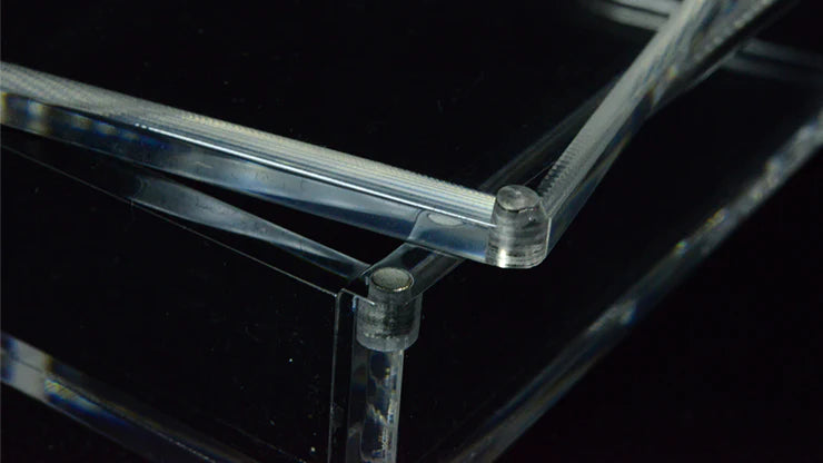 Clear acrylic furniture piece on a black background
