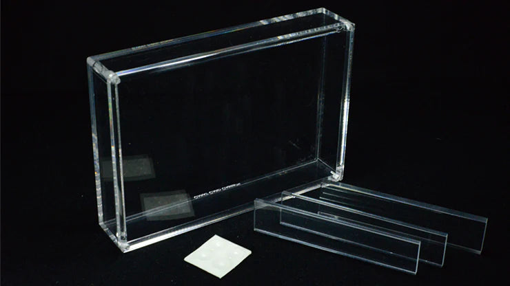 Clear acrylic display case with a black interior on a black background