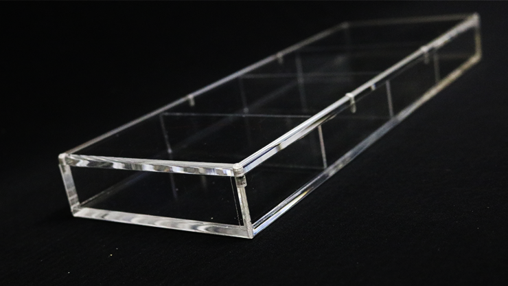 Clear acrylic display tray on a black background