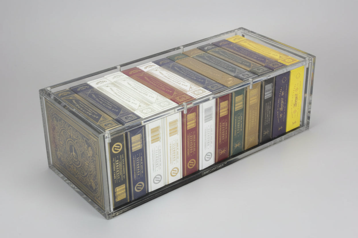 Carat X12 Brick Case displaying 12 premium playing card decks in a clear acrylic full-brick case