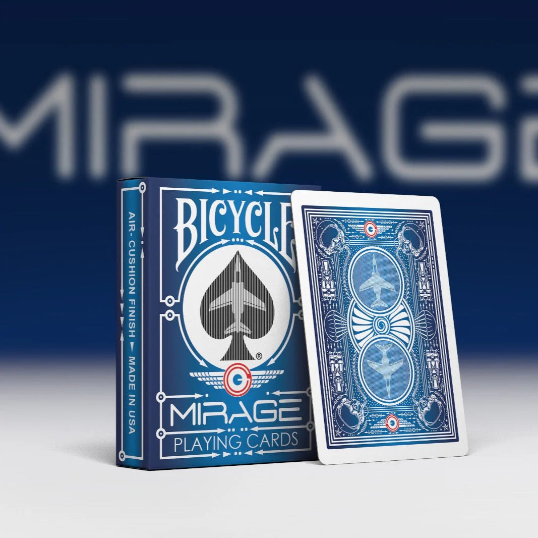 Bicycle Mirage playing cards with blue and white design on a dark blue background.