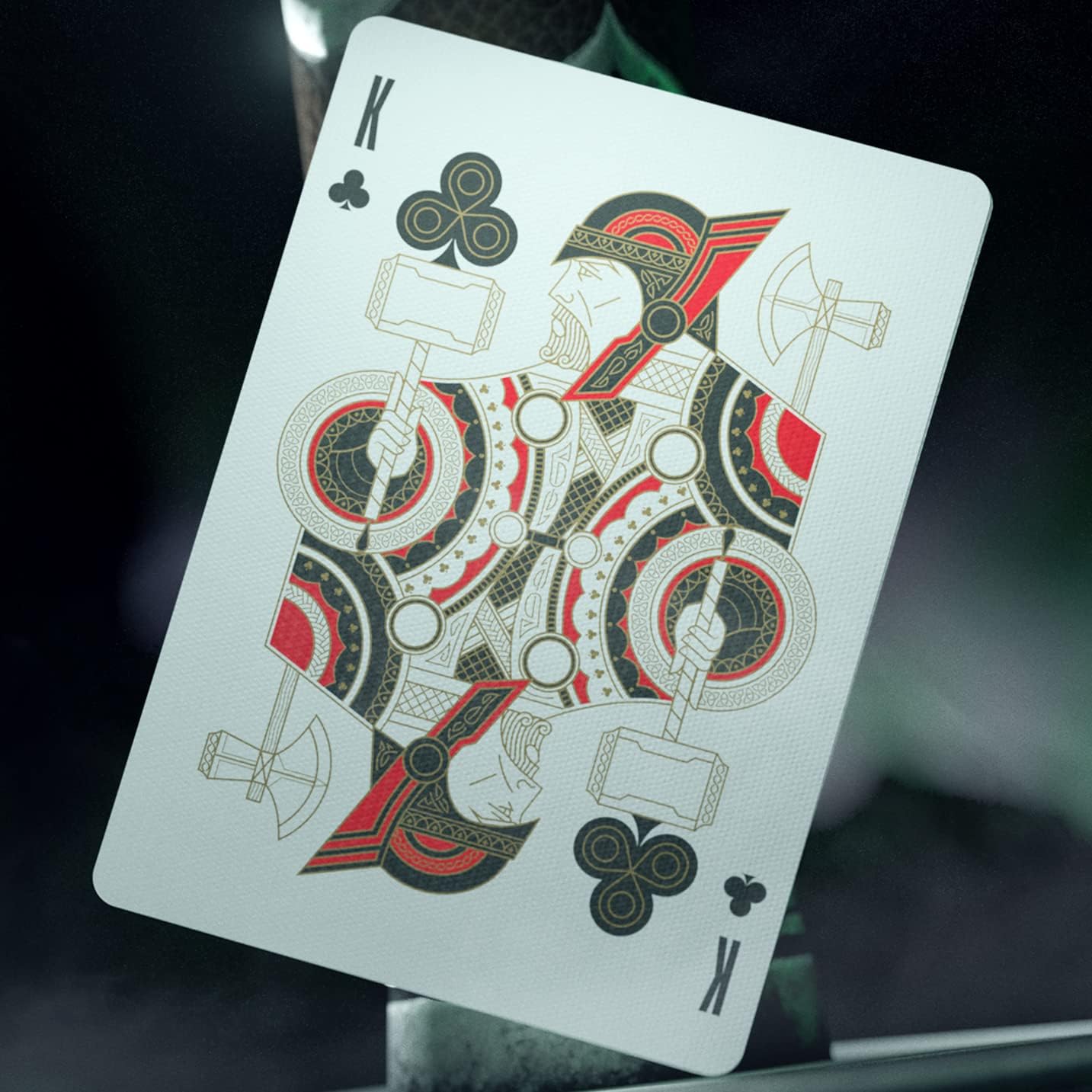 Playing card with a detailed design on a dark background