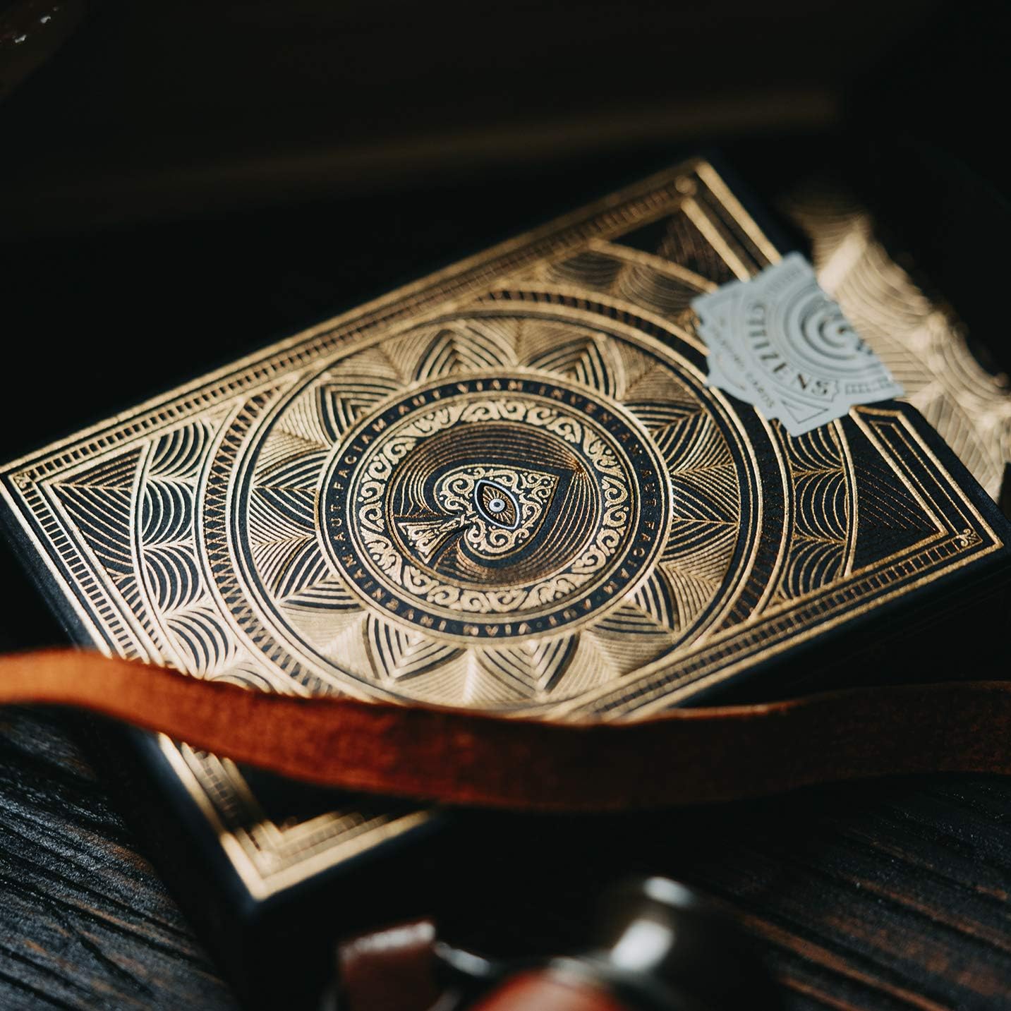 Decorative Theory11 Citizens deck with intricate gold design on a dark background