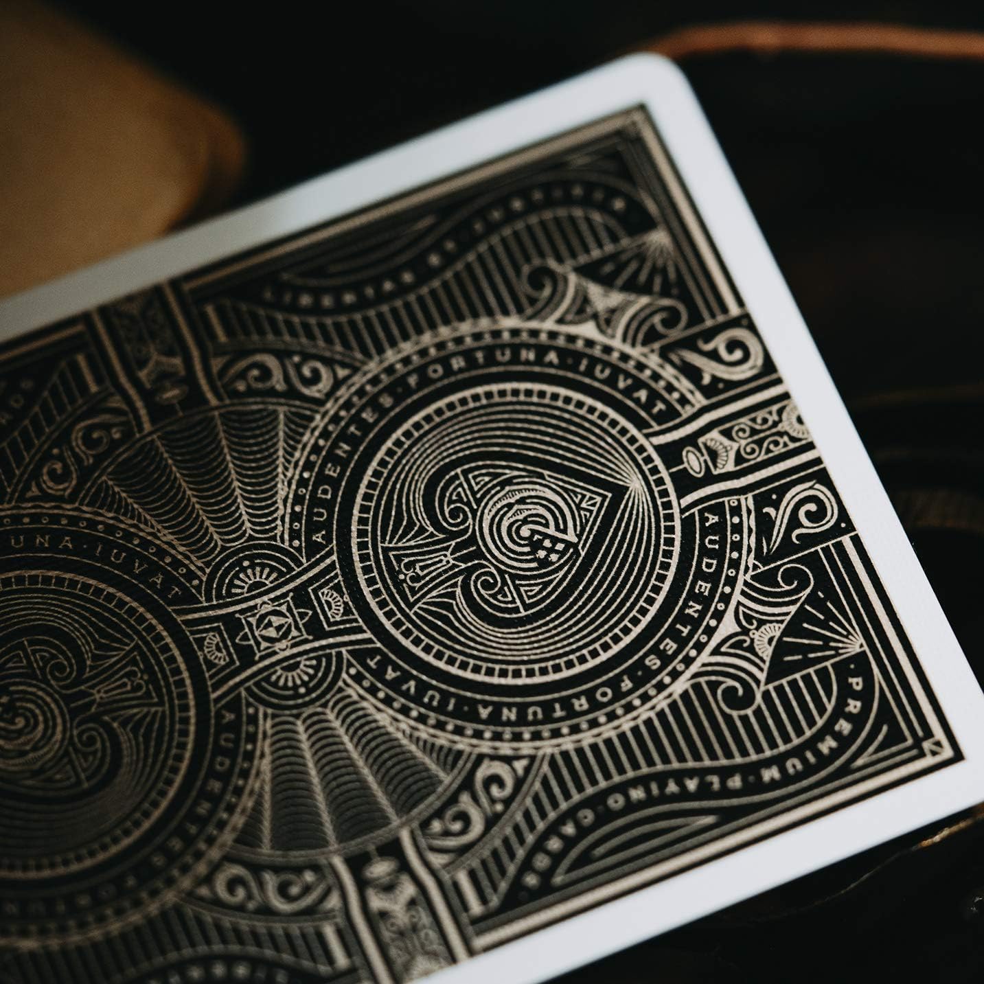 Close-up of a Theory11 Citizens playing card with intricate design and text on a dark background