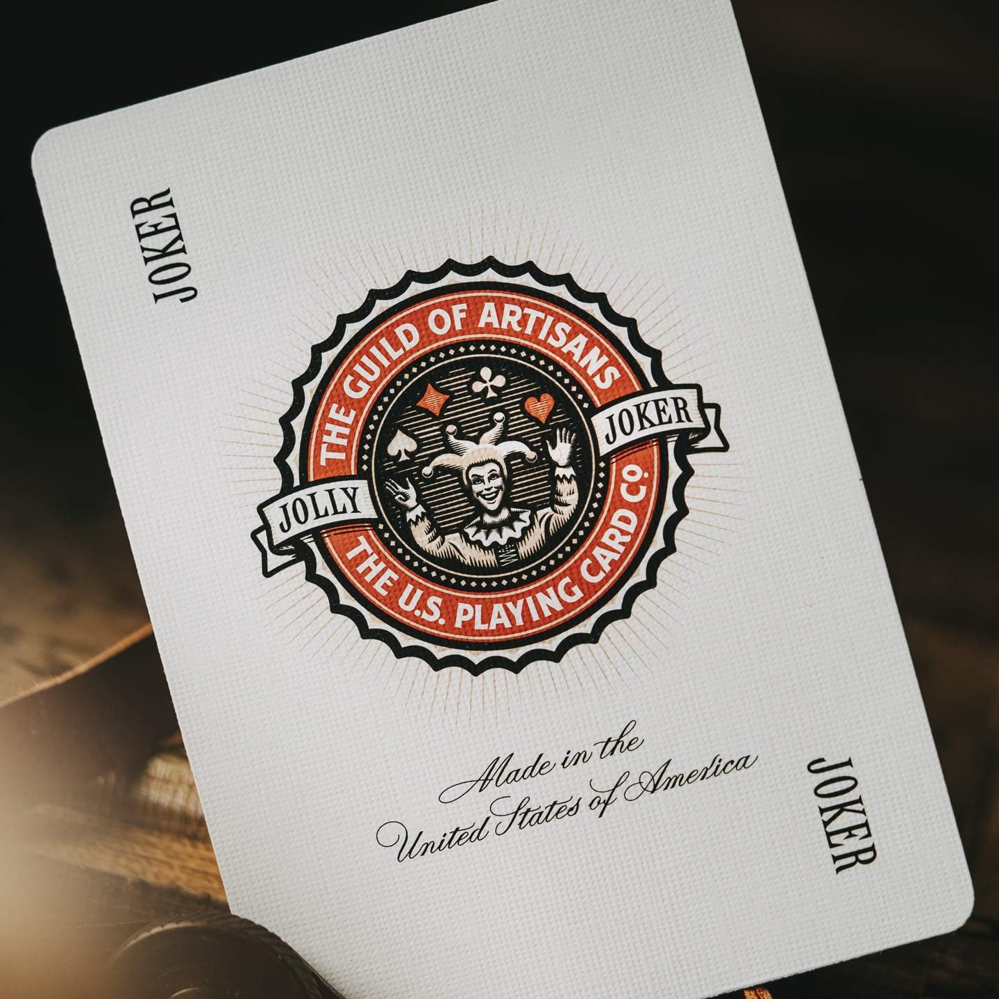 Playing card with 'The Guild of Artisans' logo and text on a dark background