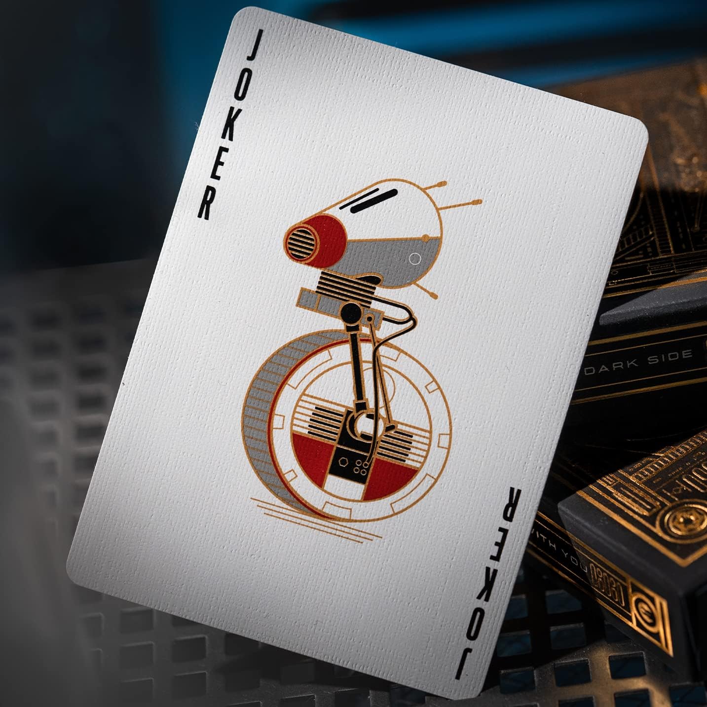 Playing card with a robot design labeled 'Joker' on a dark background