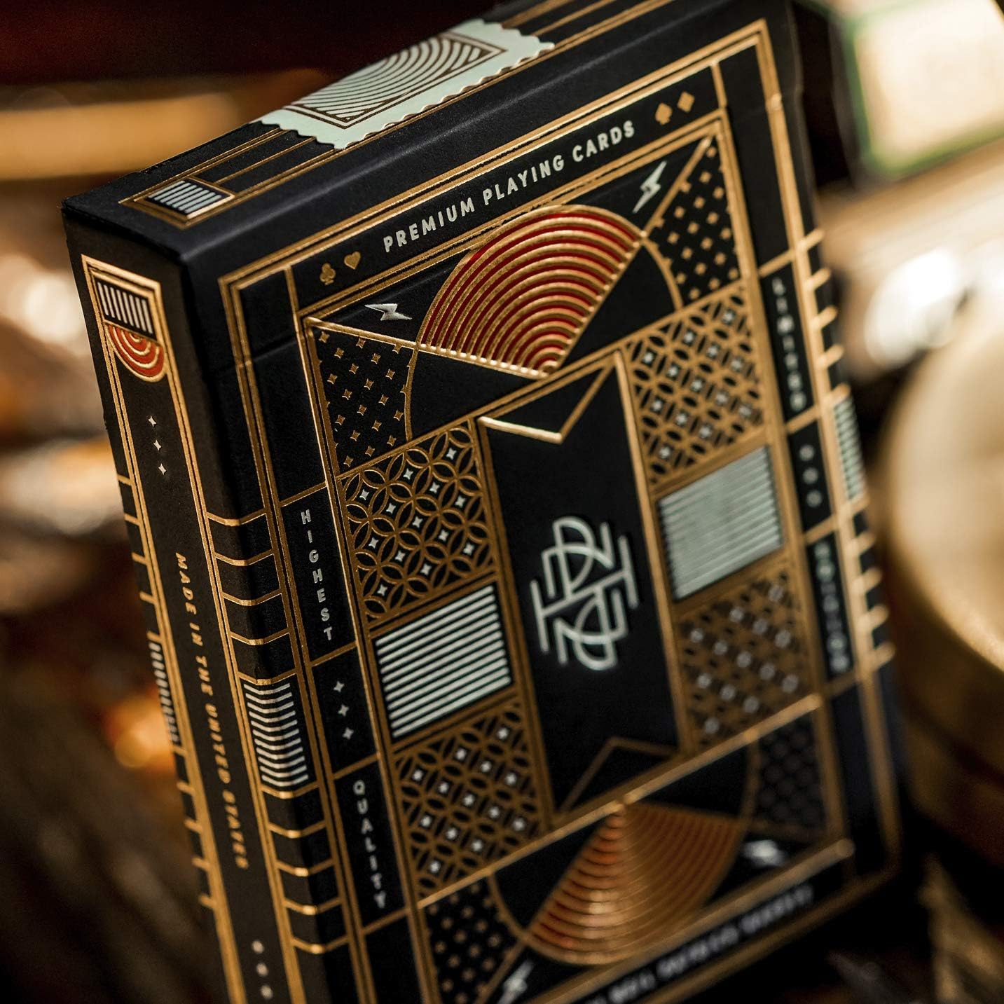 Close-up of Neil Patrick Harris theory11 tuck box with gold foil details