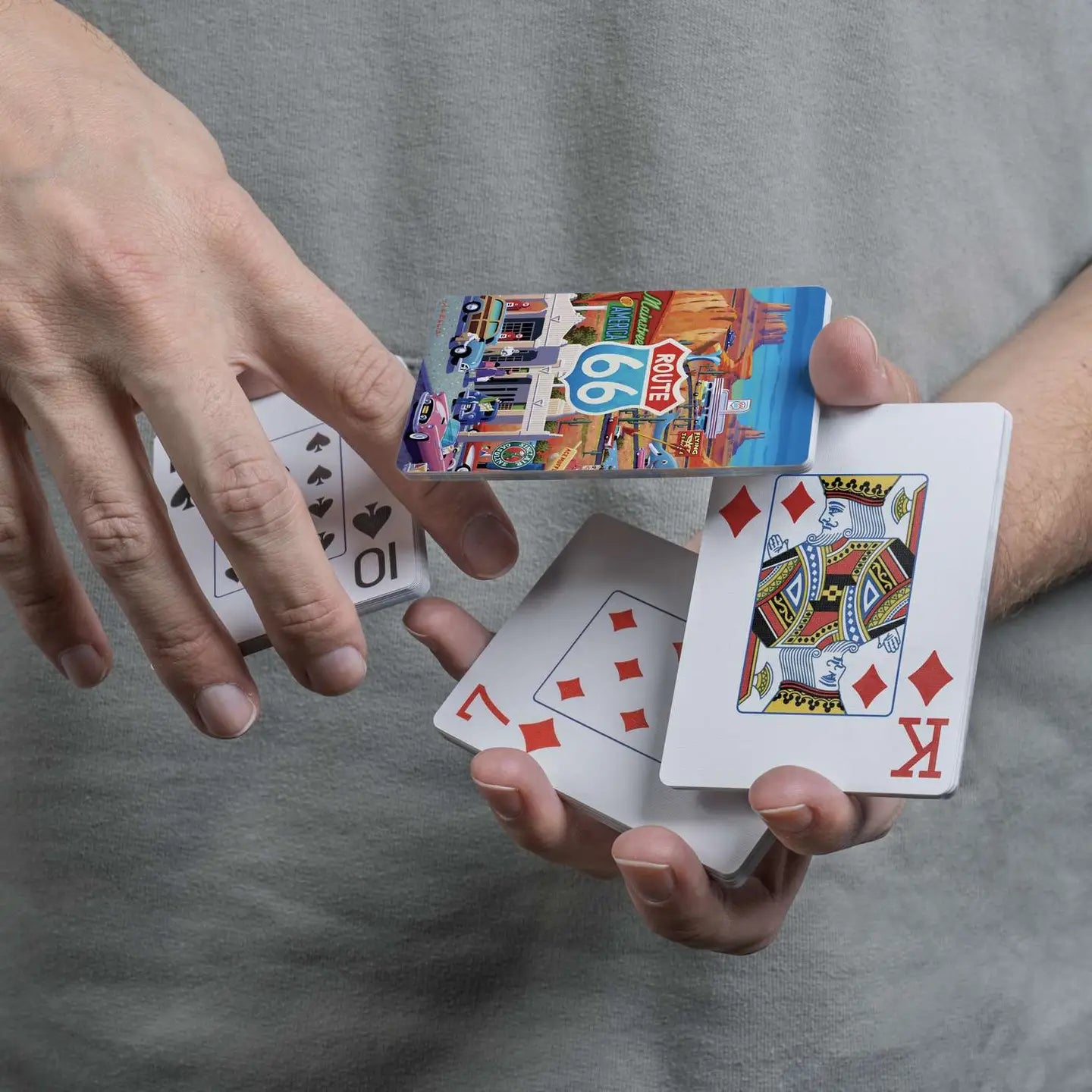 Route 66 scenic playing cards displayed in a cascading spring
