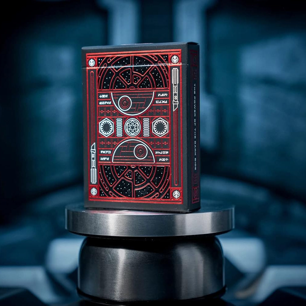 Red and black card deck on a metallic stand with a blurred background