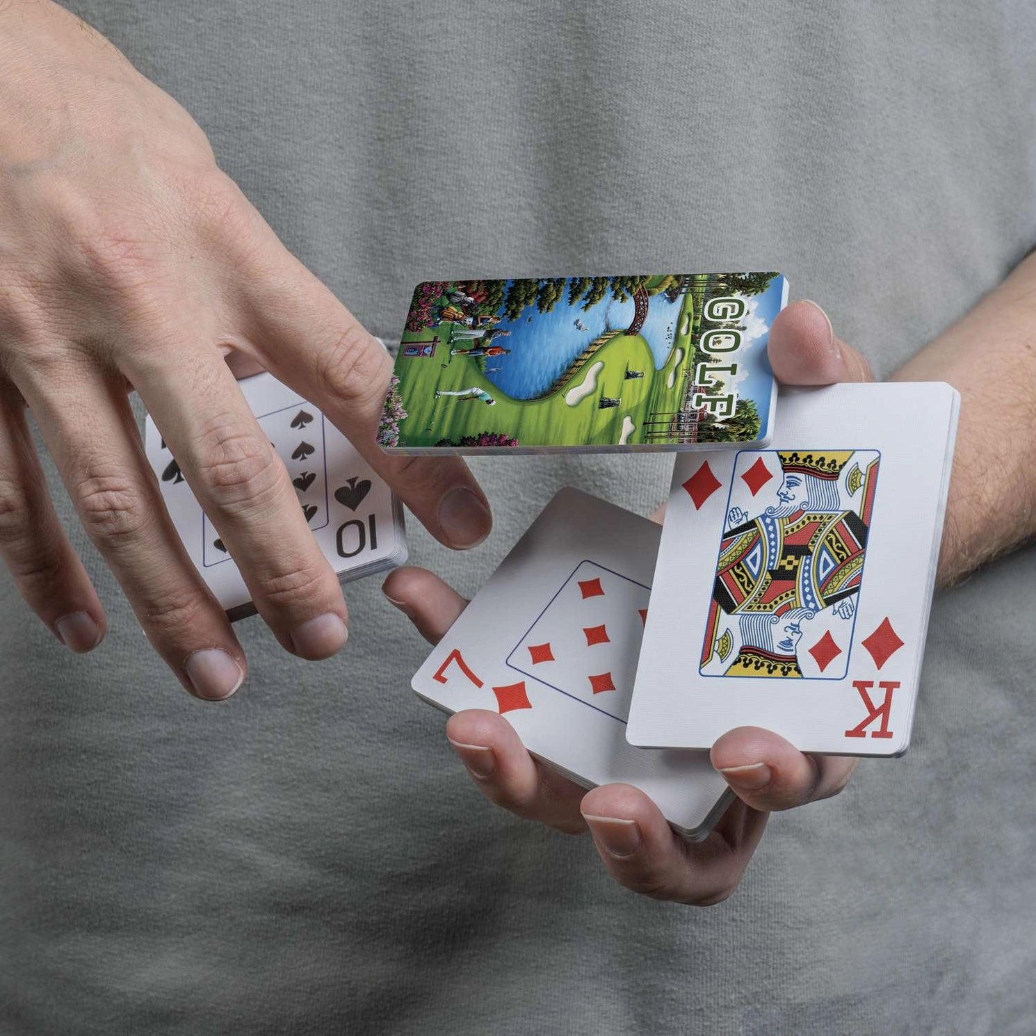 Close-up of Boardwalk Golf card back and traditional playing-card faces