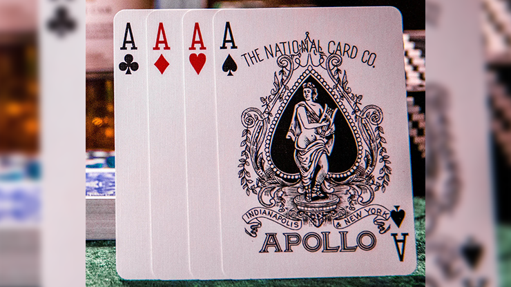 Four playing cards with 'The National Card Co Apollo' logo on a blurred background