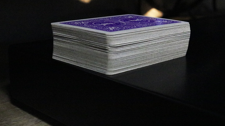Stack of Bicycle Mini Playing Cards with a purple top card on a dark surface