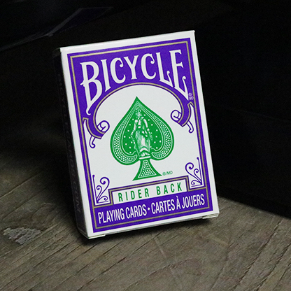 Bicycle Mini Playing Cards in Purple box on a wooden surface with a dark background