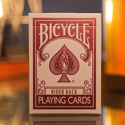 Bicycle Metallic Ruby Playing Card deck with a red and white design on a reflective surface.
