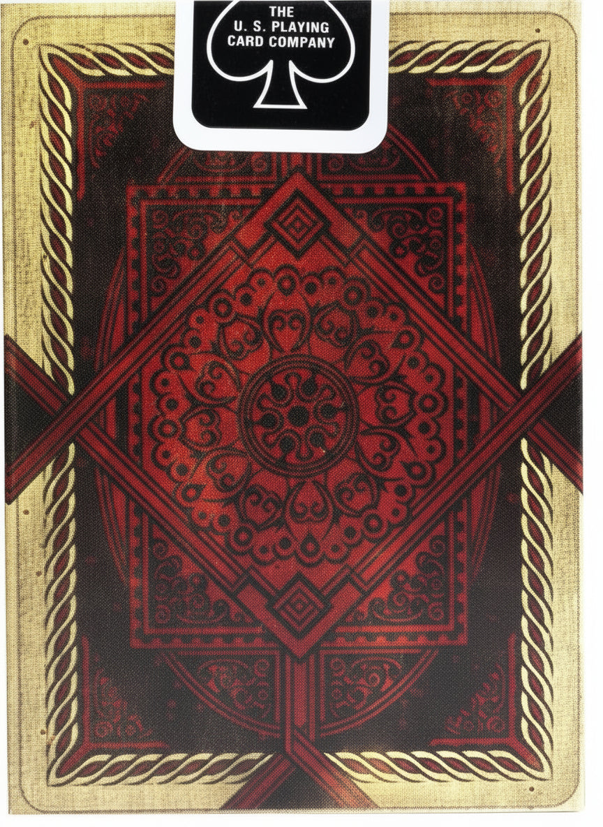 Playing card with red and gold design, U.S. Playing Card Company logo visible
