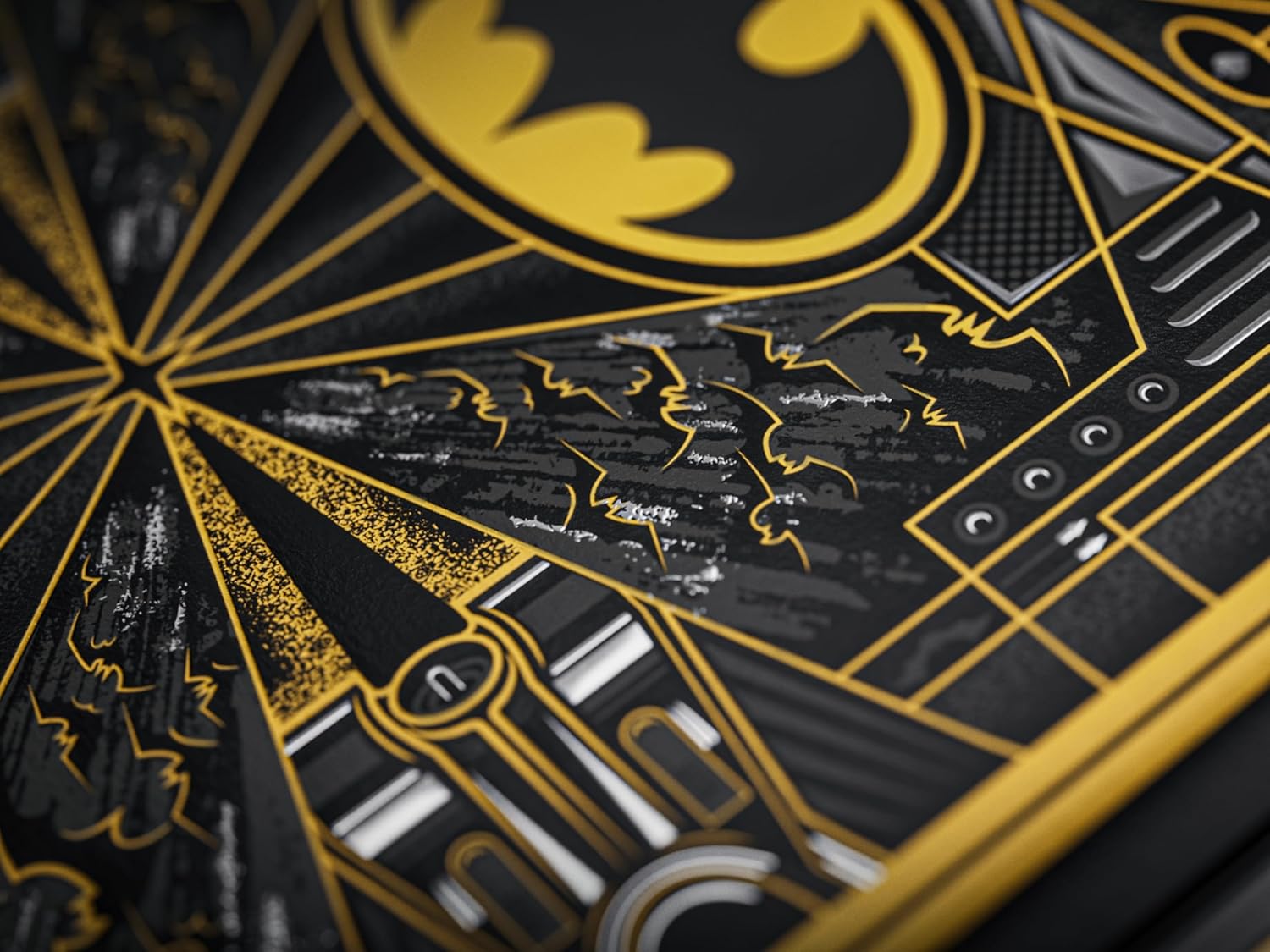 Close-up of a Batman logo with intricate design details on a dark background