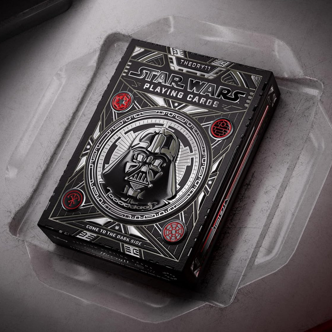Star Wars playing cards with Darth Vader design on a gray surface