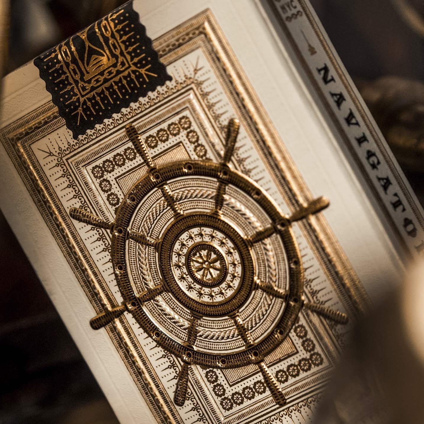 Theory11 Navigators symmetrical ship wheel card back in ivory and gold