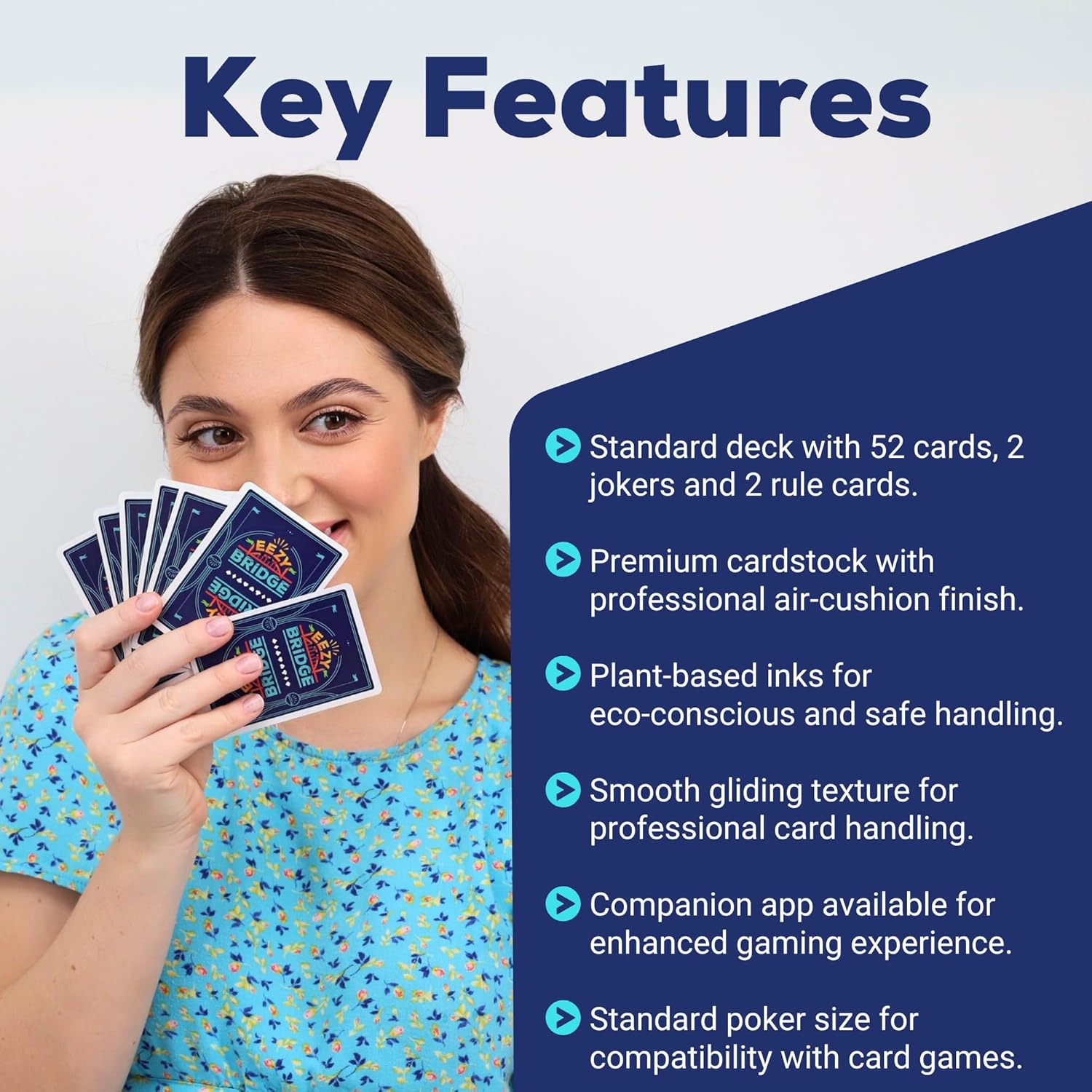 Woman holding playing cards with key features listed on a blue and white background