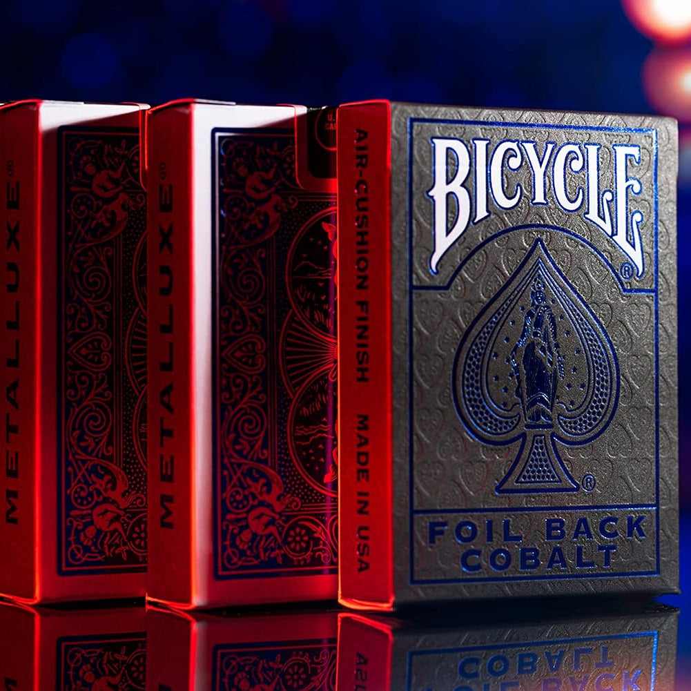 Bicycle Foil Back Cobalt playing cards with red and blue gradient background