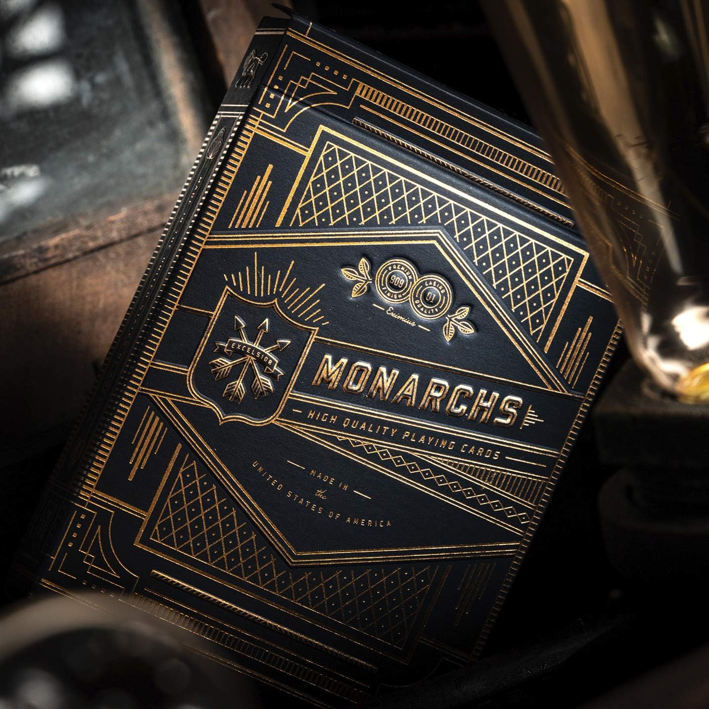 Monarchs playing cards packaging with gold and blue design