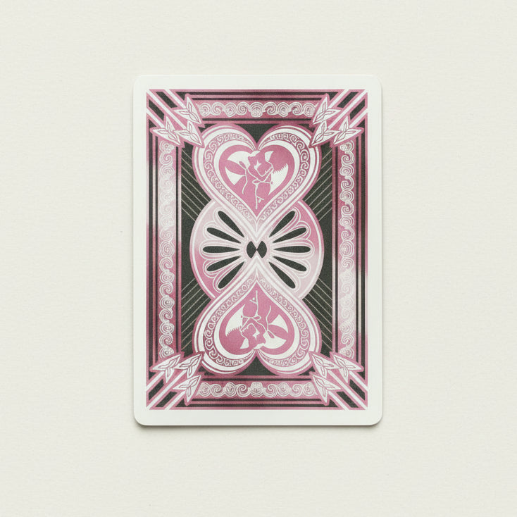 Psyche playing card with pink and black design featuring hearts and abstract patterns.